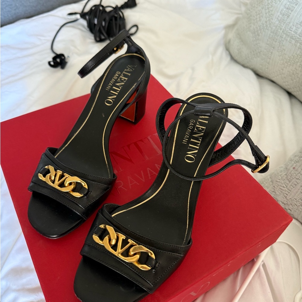 Valentino Garavani Black and Gold Heels with Stiletto Design